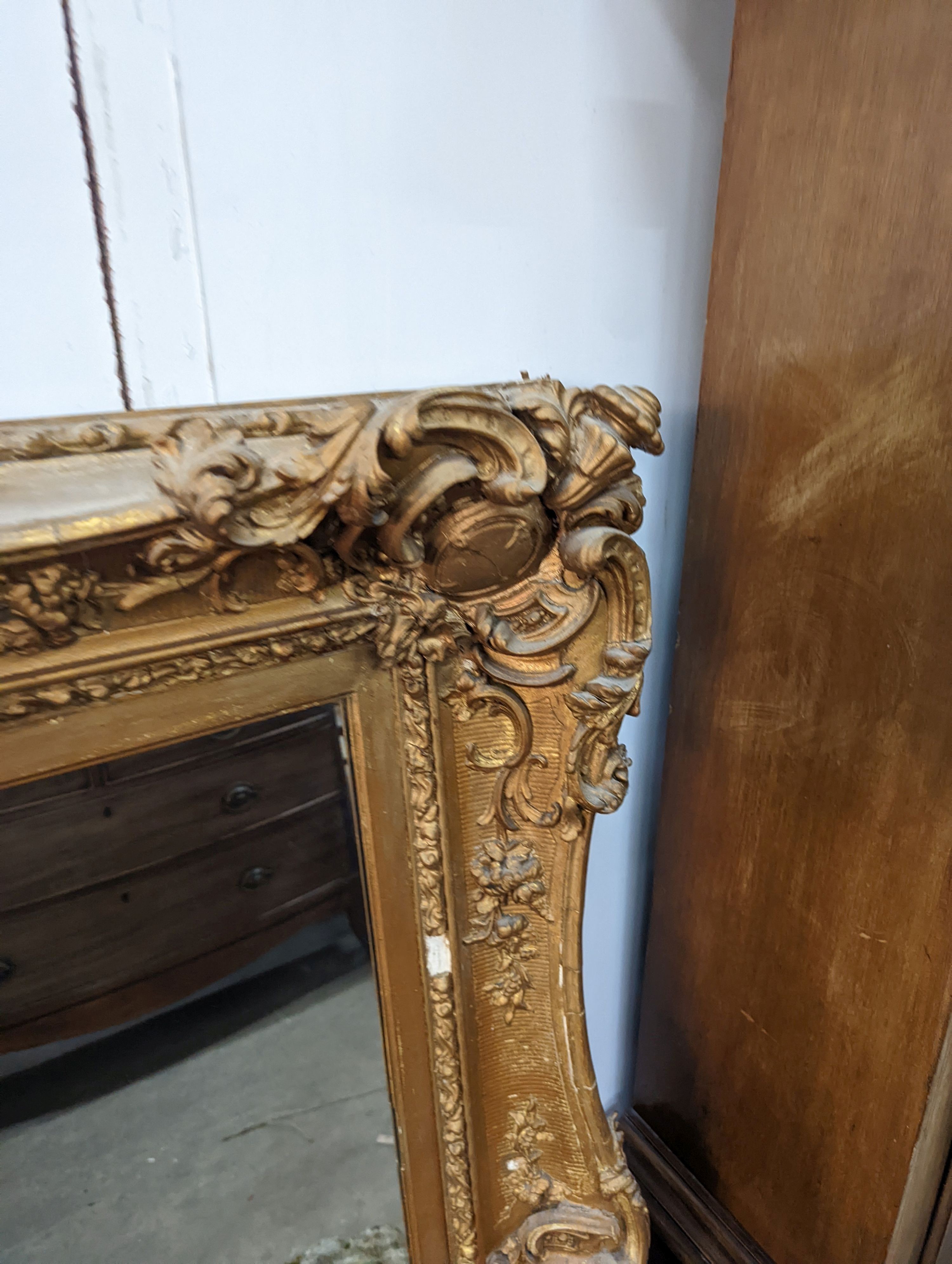 A late Victorian giltwood and gesso rectangular wall mirror, width 100cm, height 122cm